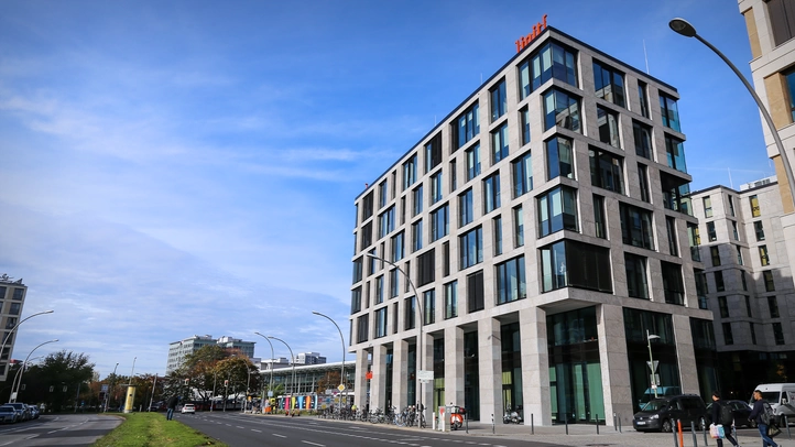 The East Side Office of ]init[ AG at the East Side Gallery in Berlin. In the background the East Station.